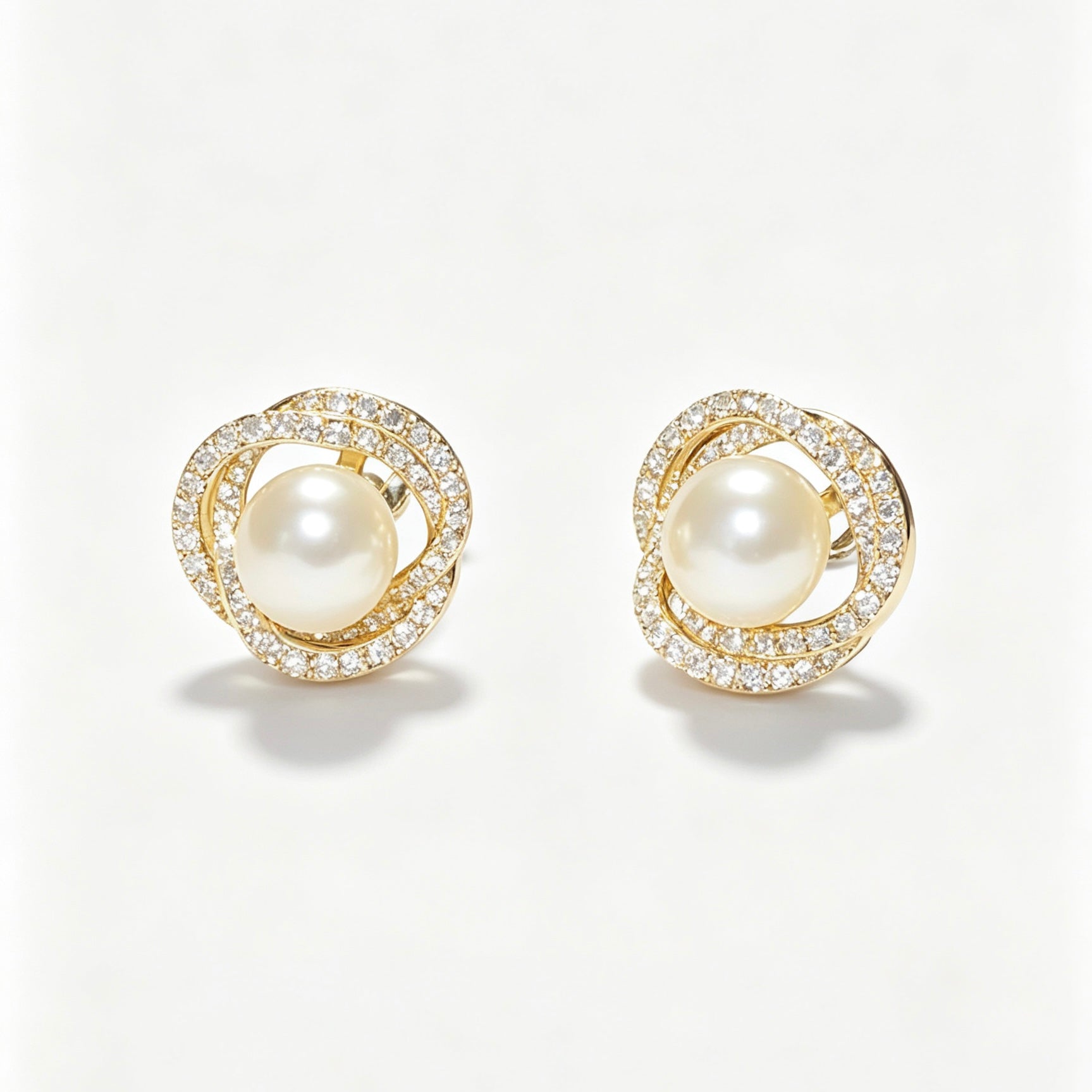 Pearl Crystal Swirl Stud Earrings in gold tone with freshwater pearl center