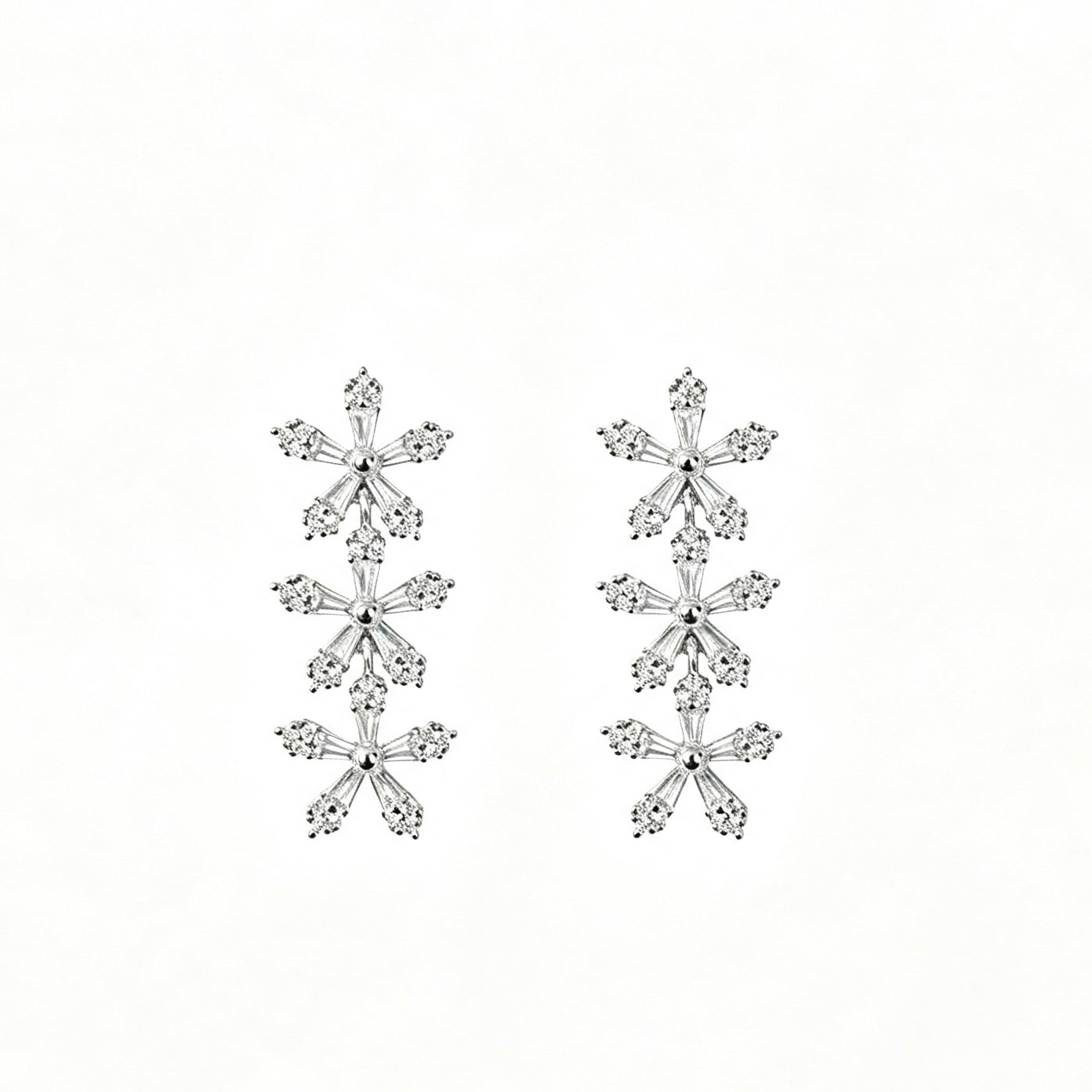 Triple Snowflake Crystal Drop Earrings in silver with baguette zirconia