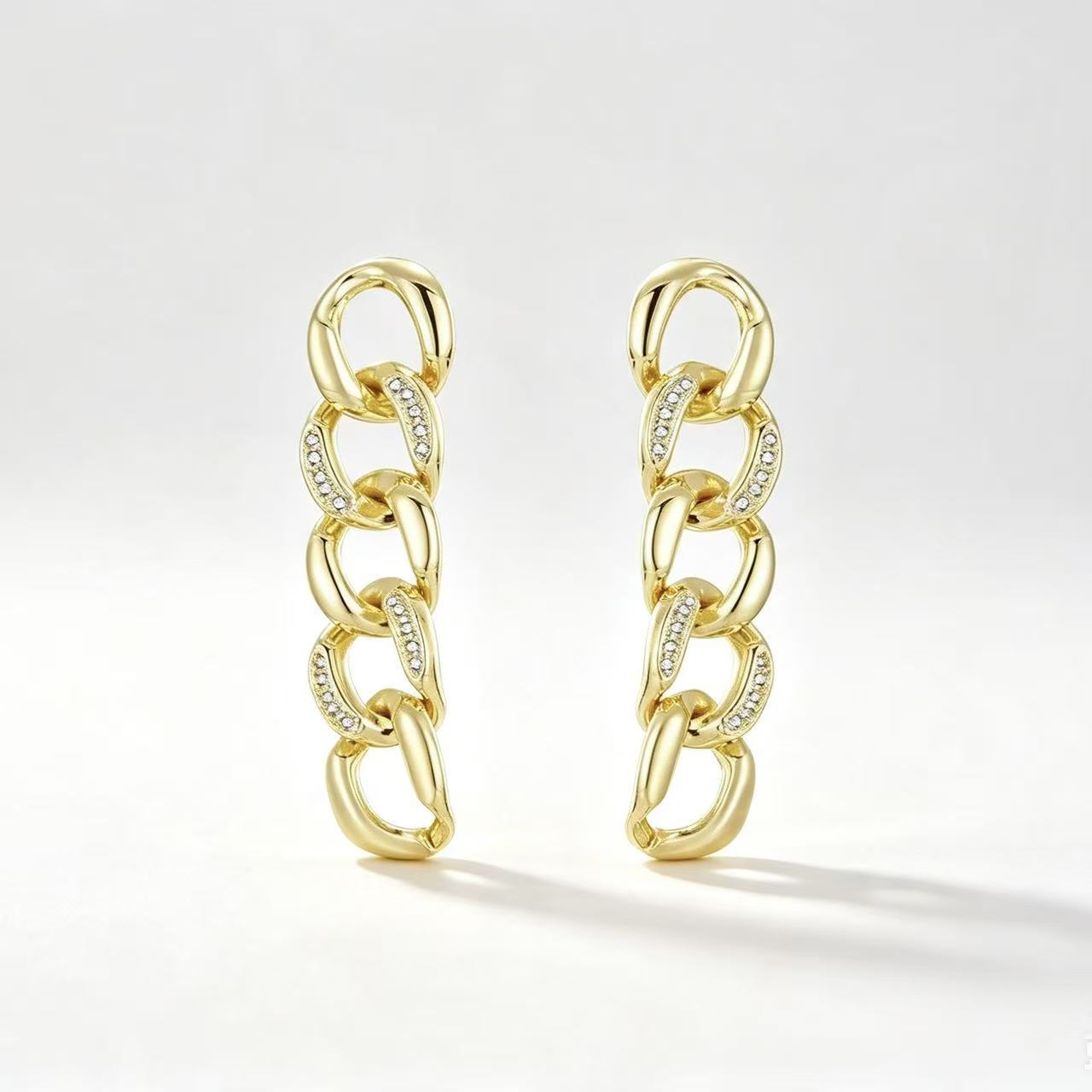 Gold tone curb chain link drop earrings with crystal pavé accents