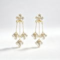 Gold tone crystal marquise tassel drop earrings with triple strand and cluster drops