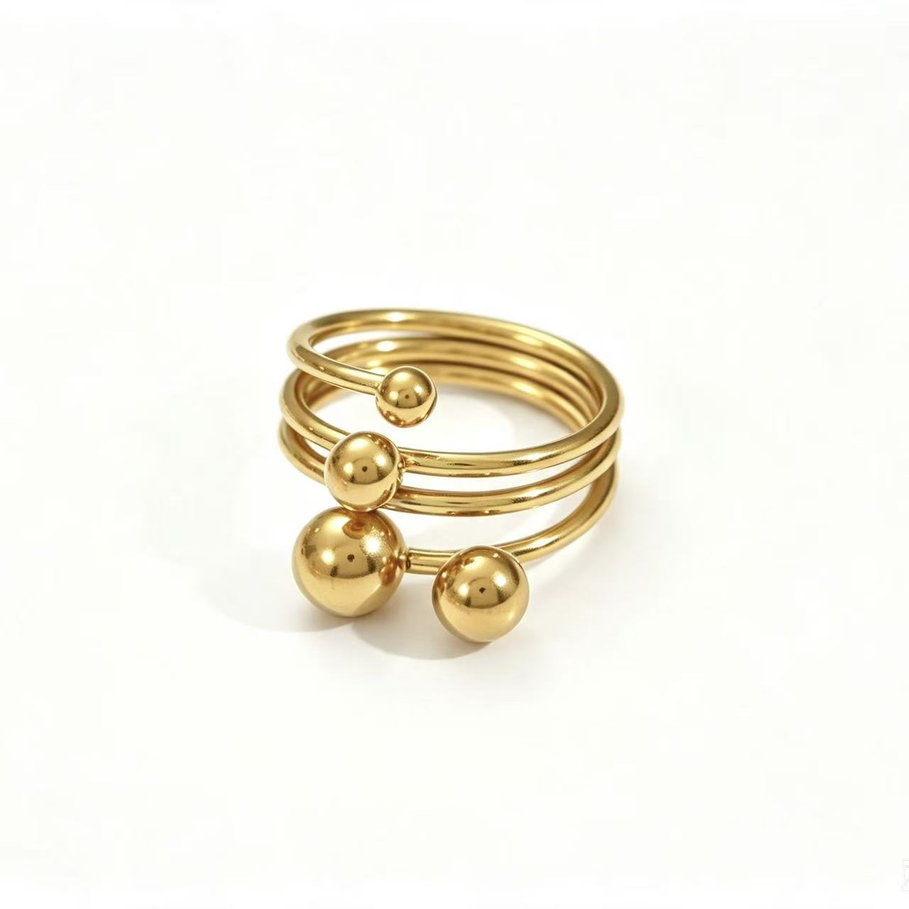 Gold Triple Spiral Ball Open Ring with graduating polished ball accents