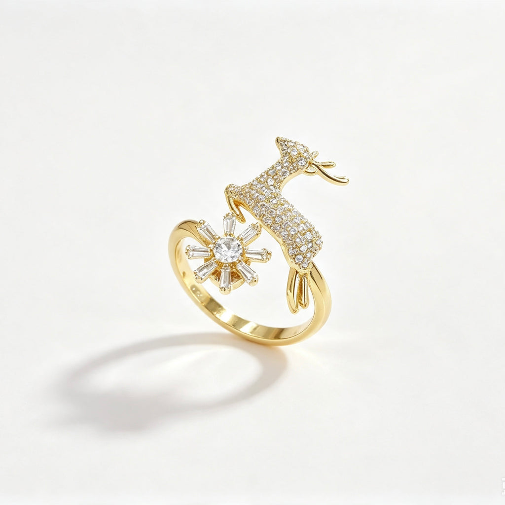 Gold open-band ring with pavé crystal deer and baguette snowflake in 18K gold plating
