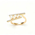 Gold double bar ring with three graduating pearls and pavé crystal top bar