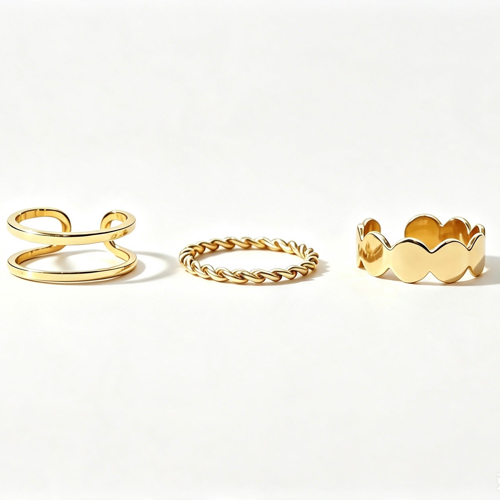 Gold 3-piece stackable ring set with double band, twisted rope, and scalloped band