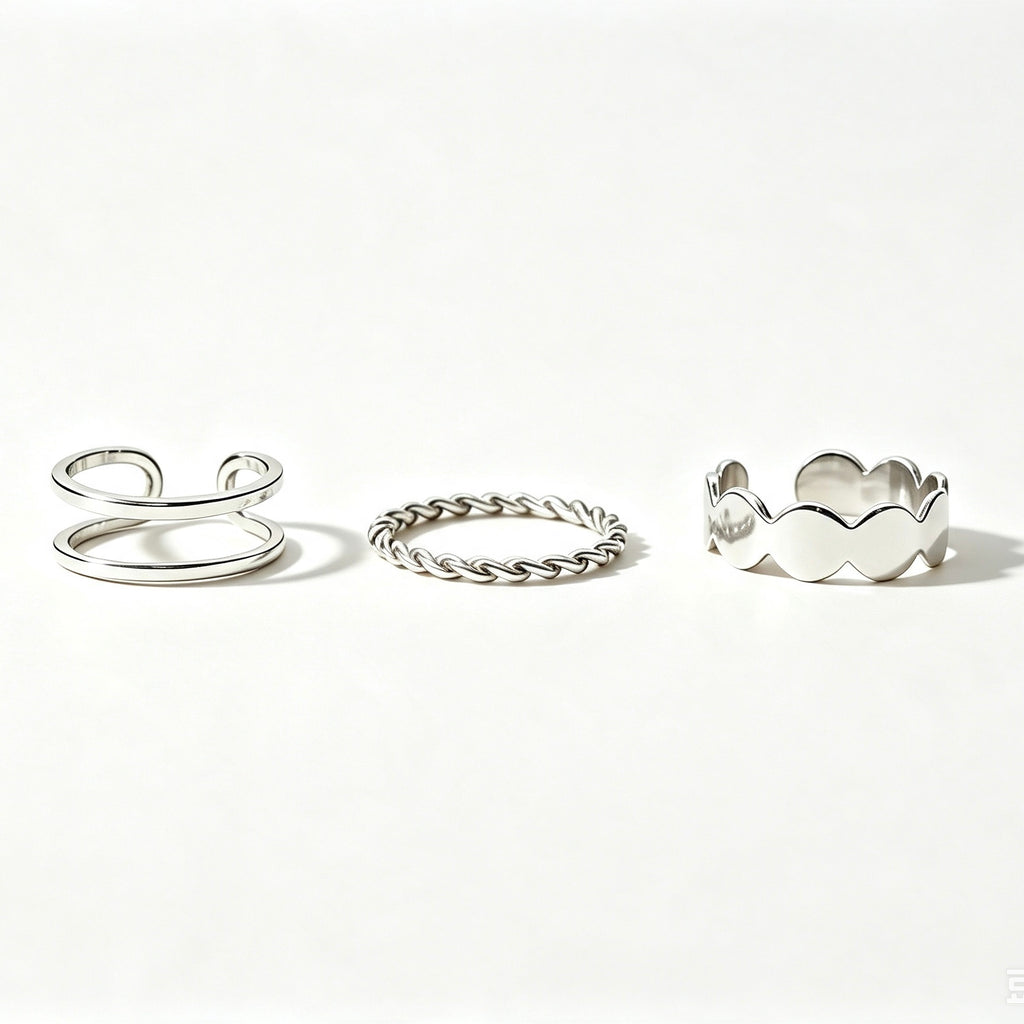Silver 3-piece stackable ring set with double band, twisted rope, and scalloped band