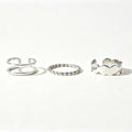 Silver 3-piece stackable ring set with double band, twisted rope, and scalloped band