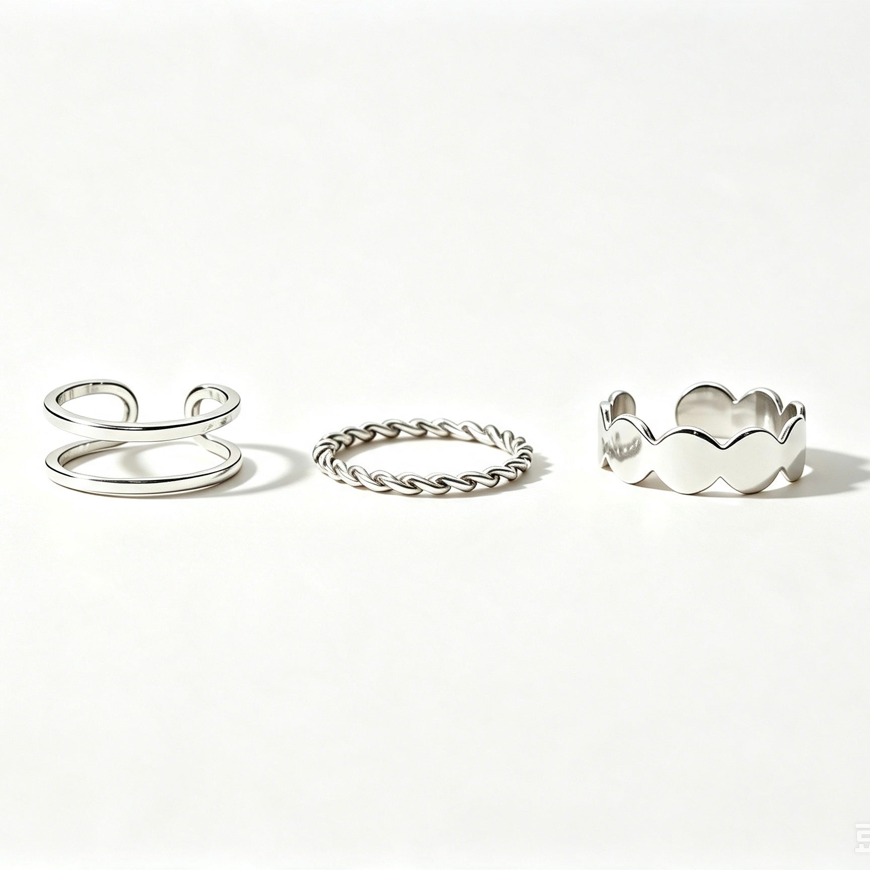 Silver 3-piece stackable ring set with double band, twisted rope, and scalloped band